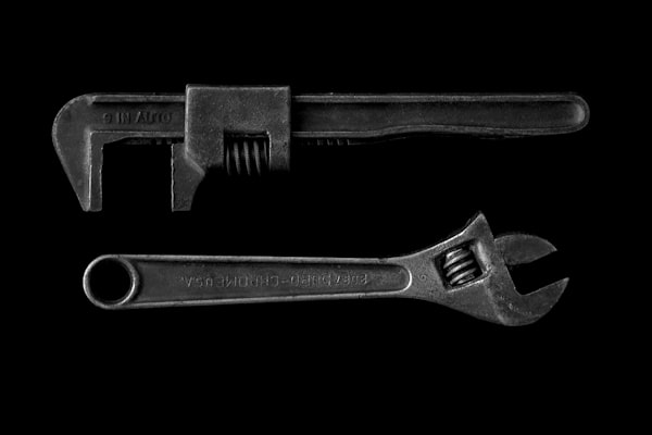 Professional plumbing pipe wrenches representing generations of plumbing craftsmanship